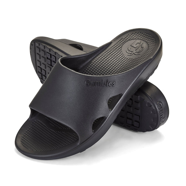 GUMBIES FRANCE black eco-friendly slides with contoured footbed and Bloom foam sole, ideal for recovery and daily wear.