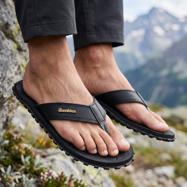 GUMBIES FRANCE black flip-flops with ergonomic footbed and durable recycled rubber sole.