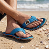 GUMBIES FRANCE blue and orange flip-flops with palm print, natural cotton straps, and recycled rubber sole.