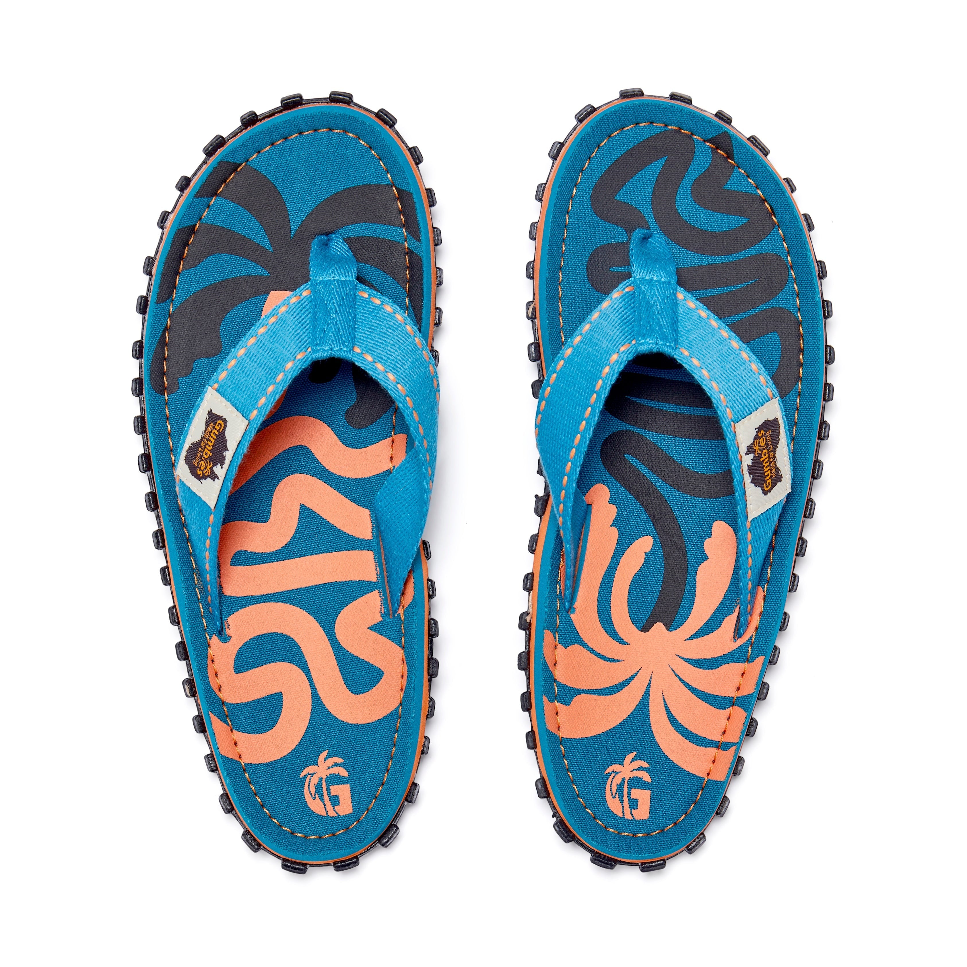 GUMBIES FRANCE blue eco-friendly men's flip-flops with orange palm leaf design and natural cotton straps.