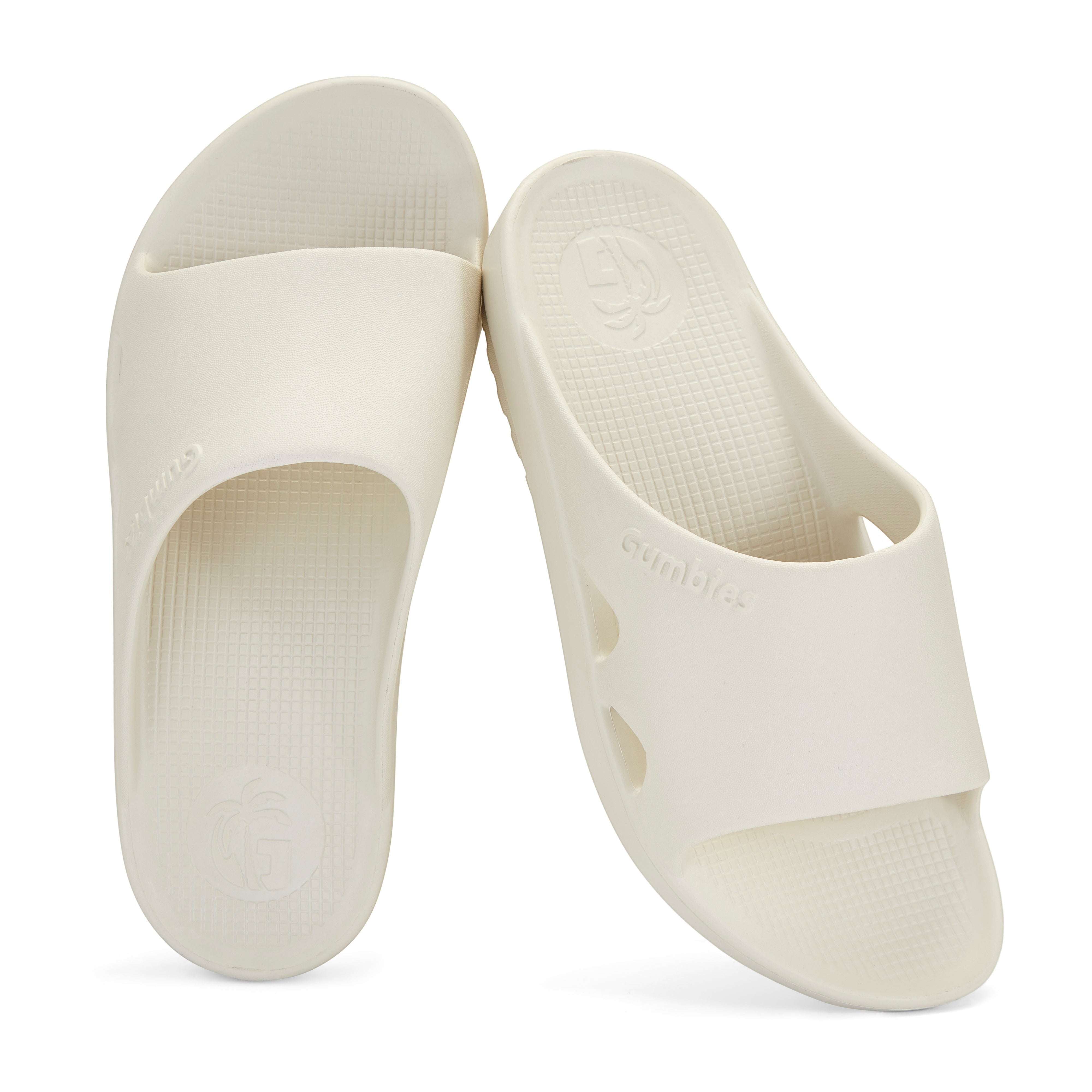 GUMBIES FRANCE cream eco-friendly slides with contoured footbed and Gumbies logo. Comfortable recovery footwear.