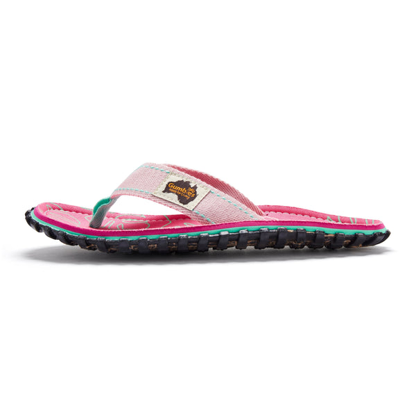GUMBIES FRANCE Islander blush pink flip-flops with hibiscus print, natural cotton straps, and recycled rubber sole.