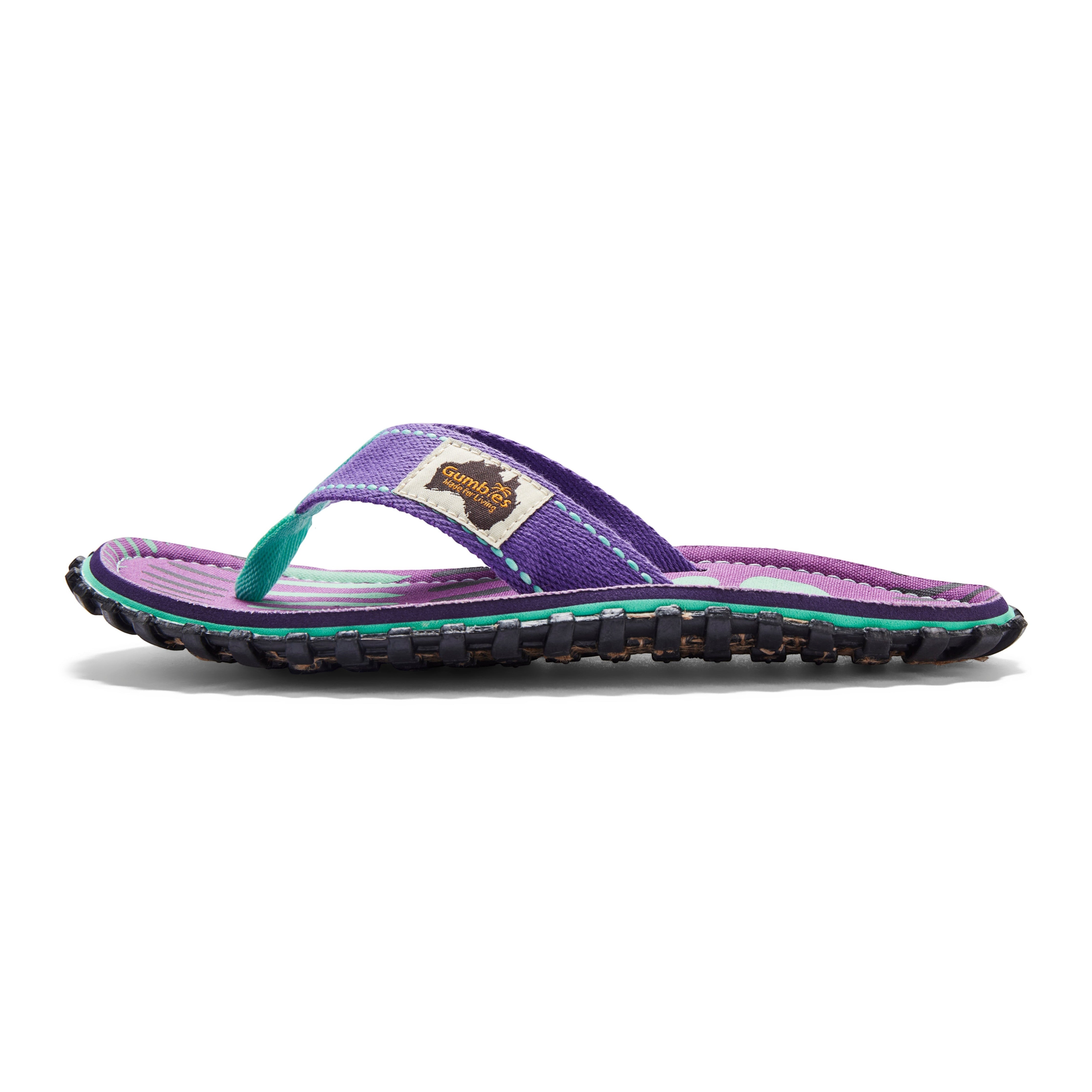 GUMBIES FRANCE Islander flip-flops with purple canvas straps and a striped footbed. Features a textured sole.