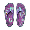 GUMBIES FRANCE Islander flip-flops with purple canvas, mint green and grey sunburst pattern, and mint green straps.