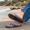 GUMBIES FRANCE Islander flip-flops in purple with mint green and black abstract pattern, mint green straps, and jute sole.