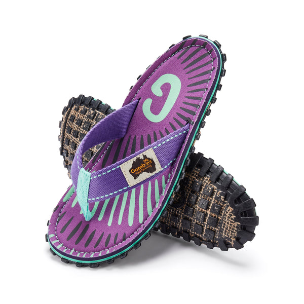 GUMBIES FRANCE Islander flip-flops in purple with teal and black abstract pattern, teal straps, and jute sole.