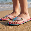GUMBIES FRANCE Islander pink flip-flops with hibiscus print, turquoise accents, and recycled rubber sole.