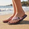 GUMBIES FRANCE Islander palm leaf pink flip-flops with a brown sole and pink straps. Made from recycled rubber and natural cotton.