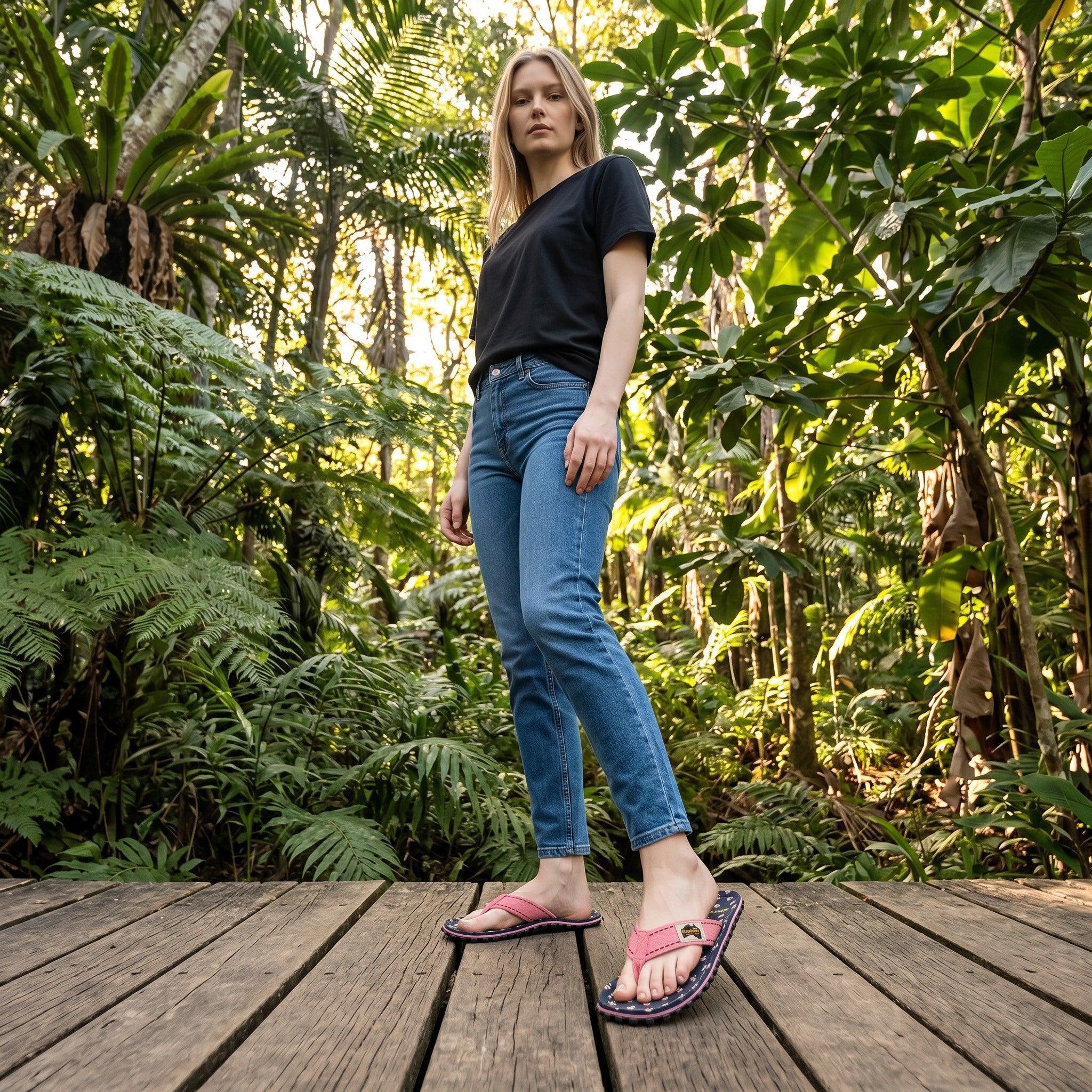 GUMBIES FRANCE Islander Primrose flip-flops with navy blue floral print and pink canvas straps.