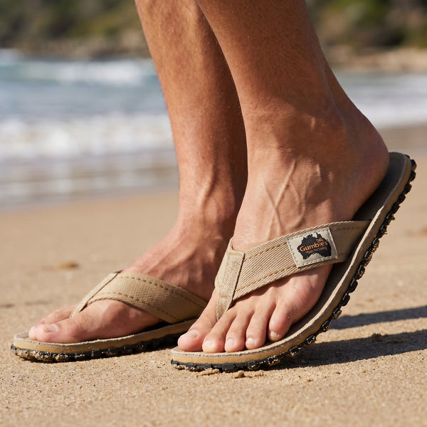 Gumbies FRANCE classic sand canvas flip-flops with a textured rubber sole and a branded tag featuring an Australian map.