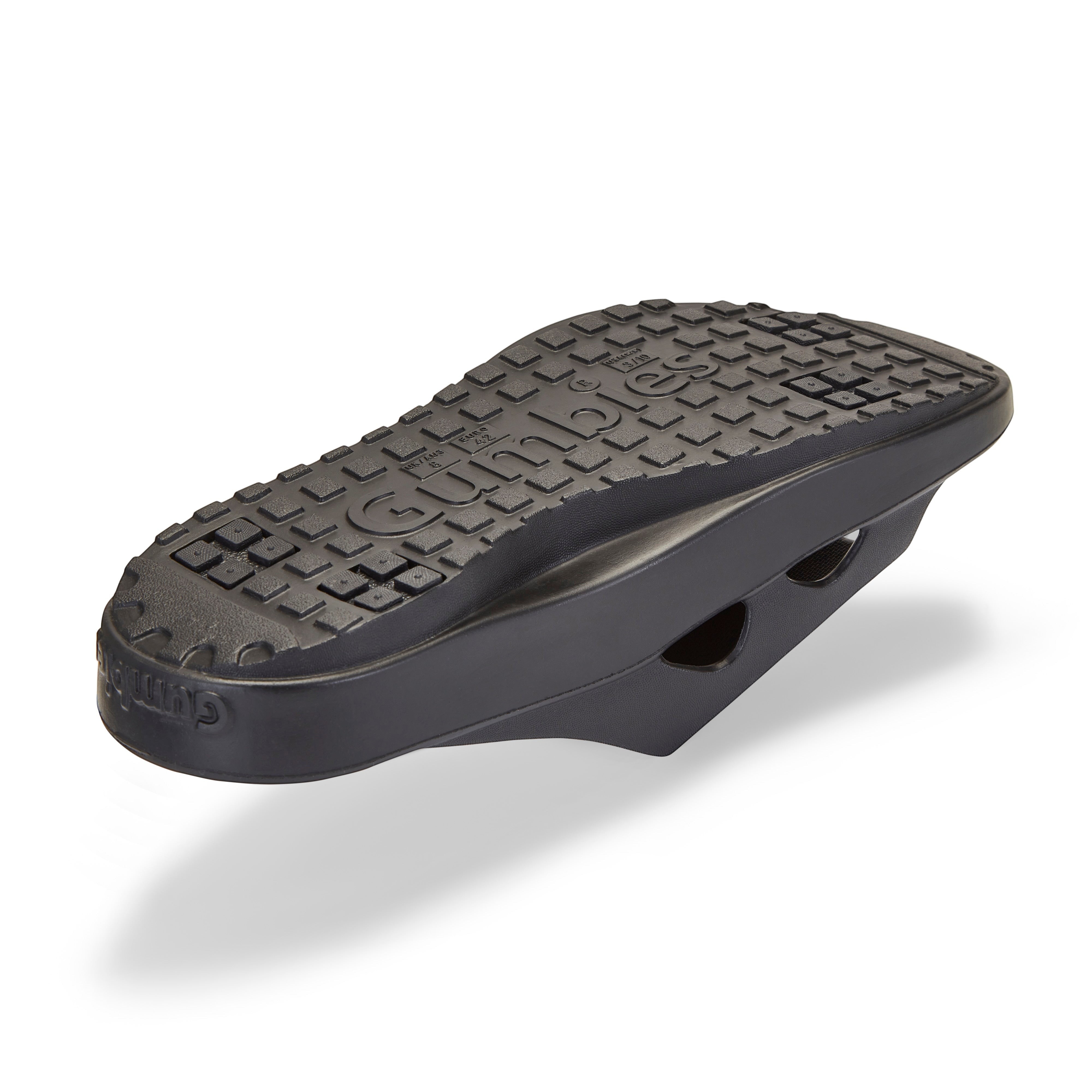 GUMBIES FRANCE Spasole black eco-friendly recovery slides with ergonomic arch support and Bloom foam sole.
