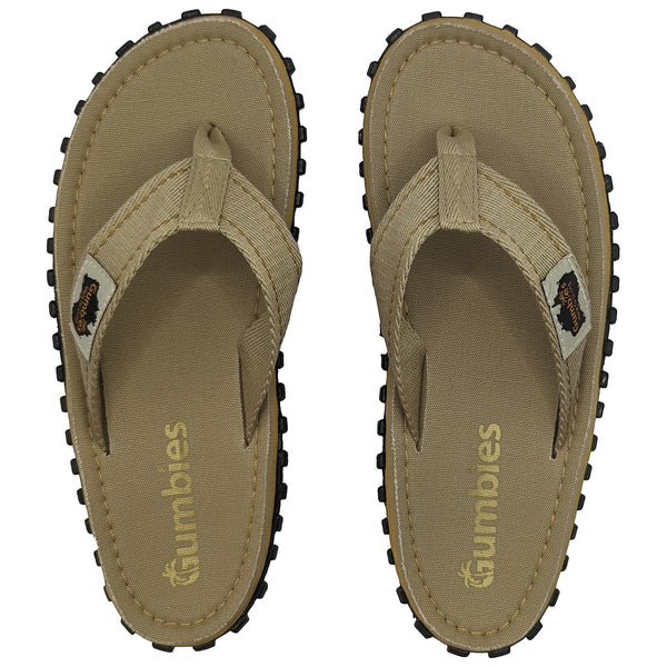 GUMBIES FRANCE tan canvas flip-flops for men and women with textured black soles and Gumbies branding.